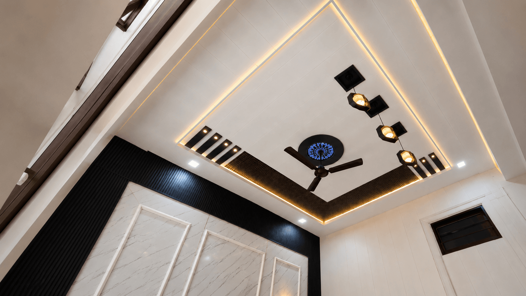 Designer false ceiling with cove lighting and recessed spotlights