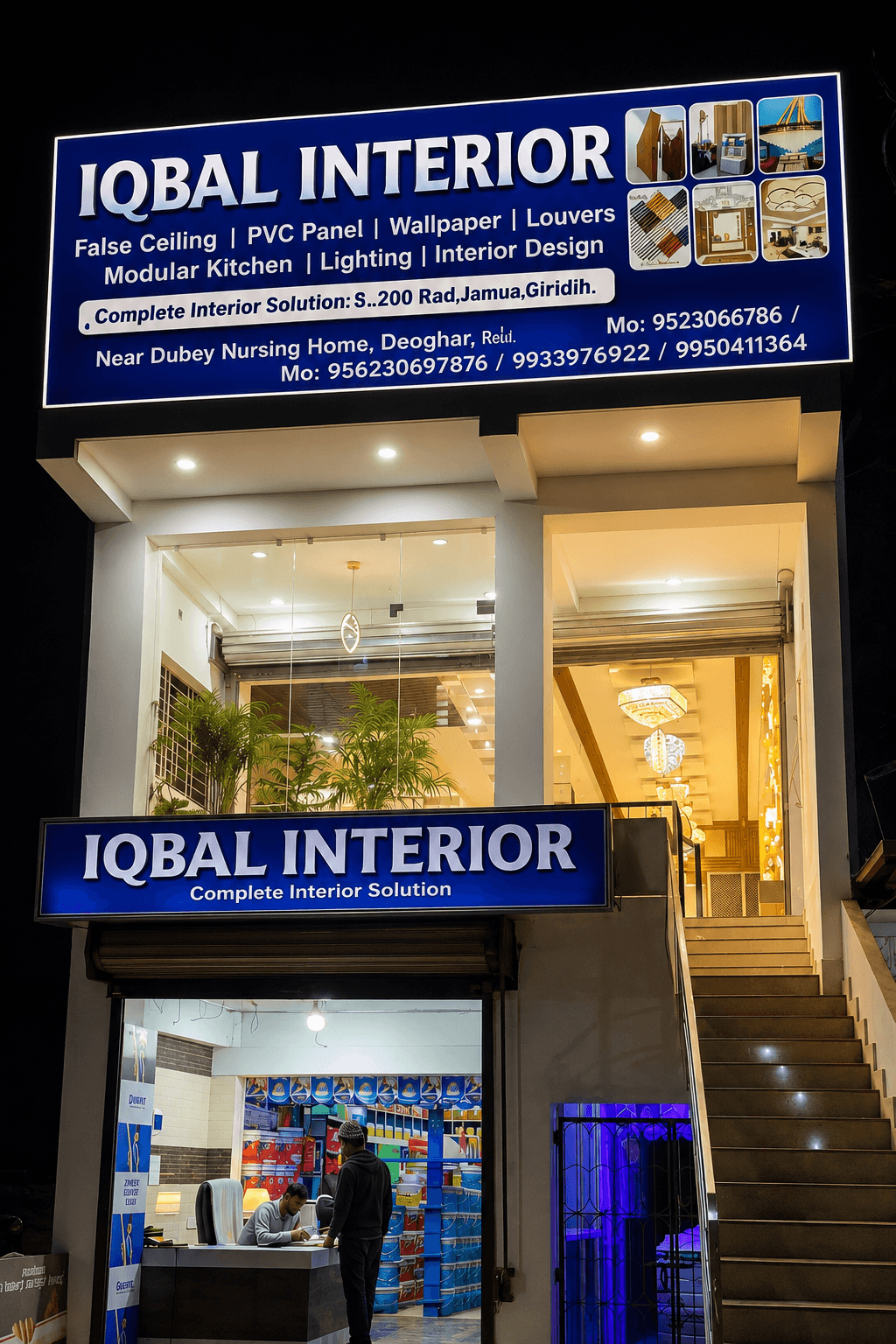 Iqbal Interiors showroom storefront in Jamua, Giridih, lit up in the evening